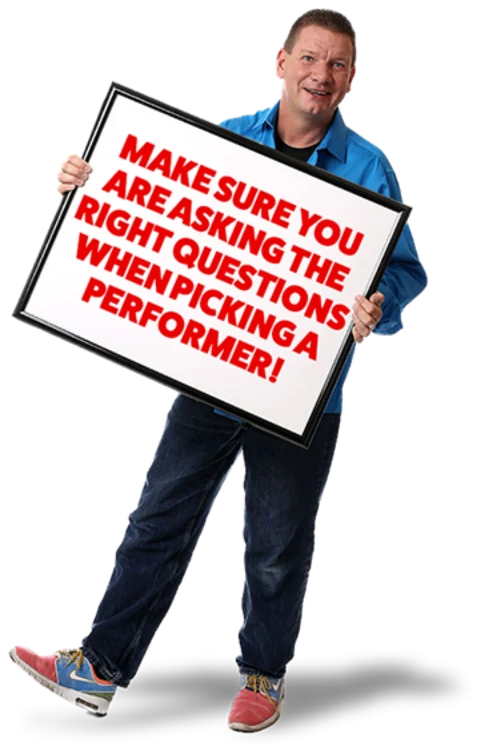 Christopher holding a sign that reads: make sure you are asking the right questions when picking a performer